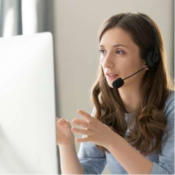Lady with a headset answering a phone call