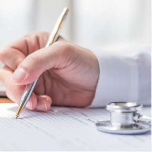 Medical staff utilising a pen and paper